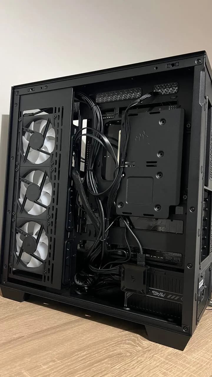 Rear of a black PC case with neatly routed cables
